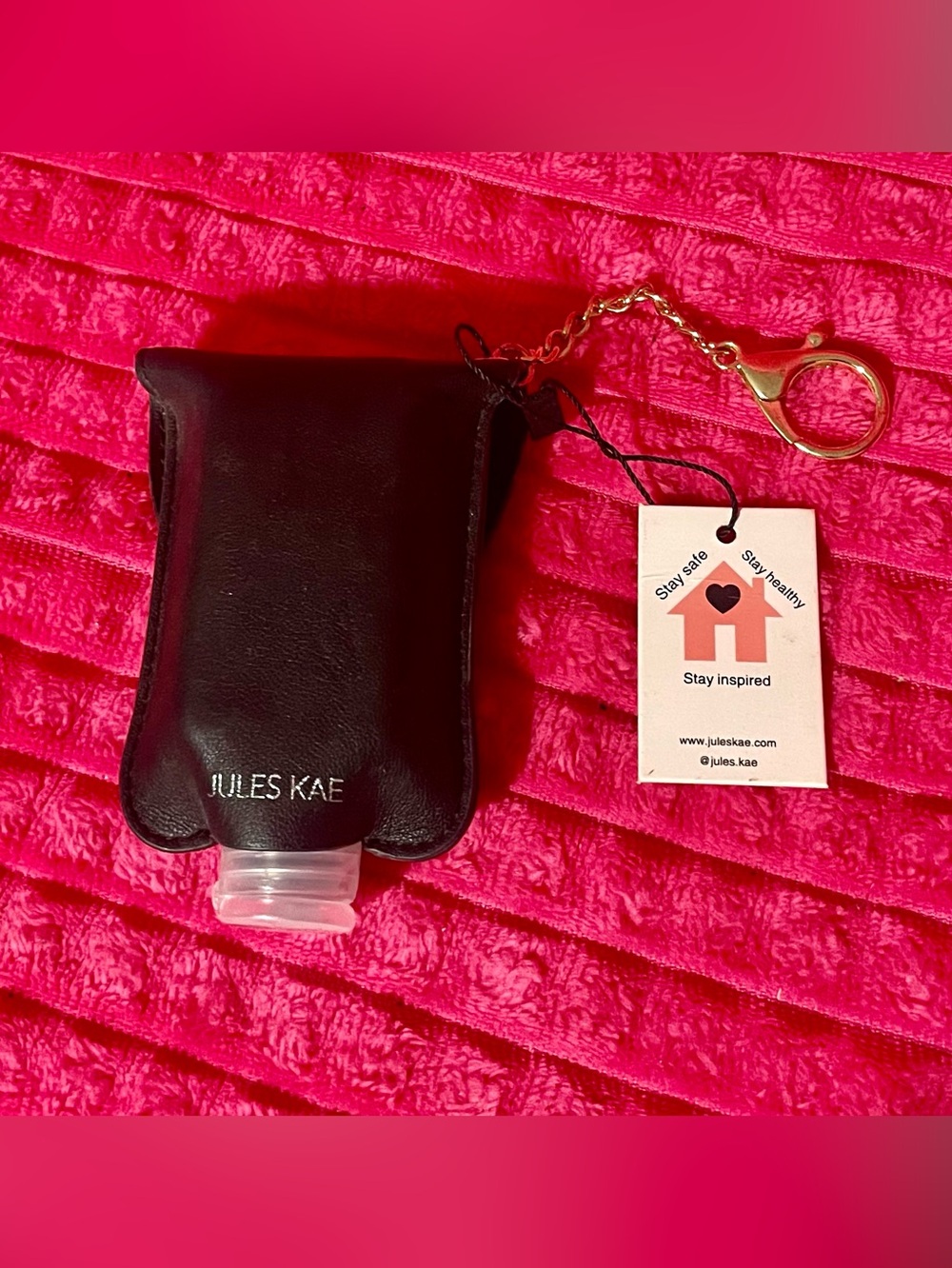 Hand Sanitizer Keychain Pouch & 2 oz bottle of sanitizer.